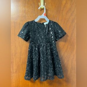 Black sequin dress. With tags. Perfect dress for the holidays! 2T